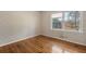 Bedroom with hardwood floors and a double-paned window at 422 Derbyshire Dr, Stone Mountain, GA 30088