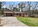 Charming brick home with a well-maintained lawn and ample parking at 422 Derbyshire Dr, Stone Mountain, GA 30088