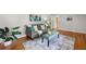 Inviting living room with a cozy sofa, area rug and ample natural light at 422 Derbyshire Dr, Stone Mountain, GA 30088