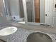 Bathroom with dual granite counter sinks and tub area at 6023 Kingston Wood Way, Lithonia, GA 30038