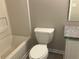 Bathroom with new toilet, shower-tub, and vanity with granite countertop at 6023 Kingston Wood Way, Lithonia, GA 30038