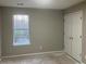 Bedroom with a window and closet at 6023 Kingston Wood Way, Lithonia, GA 30038