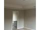Main bedroom featuring tray ceiling and adjoining bathroom at 6023 Kingston Wood Way, Lithonia, GA 30038