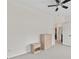 Neutral bedroom with carpet flooring, ceiling fan and view to the hall at 5310 Corinth Ct, Cumming, GA 30040