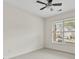 Light-filled bedroom featuring neutral carpet, a window, and a ceiling fan at 5310 Corinth Ct, Cumming, GA 30040