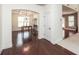 Dining room featuring coffered ceilings, wainscoting, and hardwood floors at 5310 Corinth Ct, Cumming, GA 30040