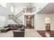 Bright living room with staircase, neutral carpet, and elegant decor at 5310 Corinth Ct, Cumming, GA 30040