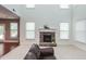 Bright living area featuring a fireplace, natural light, and neutral decor at 5310 Corinth Ct, Cumming, GA 30040