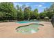 Community pool with surrounding lounge chairs and shaded seating area at 5310 Corinth Ct, Cumming, GA 30040