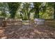 Private backyard deck surrounded by mature trees at 1712 Evans Sw Dr, Atlanta, GA 30310