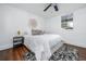 Cozy bedroom featuring a ceiling fan, an accent rug, and a comfortable bed at 1712 Evans Sw Dr, Atlanta, GA 30310