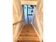 Wooden basement stairs lead to potential living or storage space with natural light at 3345 Stoneleigh Run Dr, Buford, GA 30519