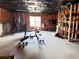 Unfinished basement with fitness equipment and potential for customization and storage at 3345 Stoneleigh Run Dr, Buford, GA 30519