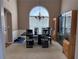 Formal dining room featuring an elegant chandelier, and arched window for natural light at 3345 Stoneleigh Run Dr, Buford, GA 30519