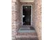 Inviting entrance with a brick surround and a view into the home's interior at 3345 Stoneleigh Run Dr, Buford, GA 30519