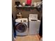 Convenient laundry room with Samsung washer and dryer, plus upper shelving for storage at 3345 Stoneleigh Run Dr, Buford, GA 30519