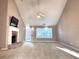 Spacious living room featuring a brick fireplace, vaulted ceiling, and neutral decor at 3345 Stoneleigh Run Dr, Buford, GA 30519