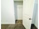 Walk-in closet with ample storage space, complete with carpet flooring at 124 Auburn Run Ln, Auburn, GA 30011