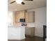 Well-lit kitchen with gray cabinets, stainless appliances, and quartz countertops at 124 Auburn Run Ln, Auburn, GA 30011