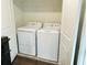 Functional laundry room with washer and dryer units at 124 Auburn Run Ln, Auburn, GA 30011