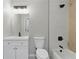 Updated bathroom featuring white vanity, modern fixtures, with a geometric tile design in the shower at 1383 Palmer Sw Pl, Mableton, GA 30126