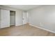 Bedroom with hard wood floors, closets with panel doors and doorways offering seamless flow and neutral color at 1383 Palmer Sw Pl, Mableton, GA 30126