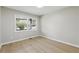 Bedroom with hard wood floors, two windows for natural light and neutral paint for a bright, airy feel at 1383 Palmer Sw Pl, Mableton, GA 30126