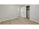 Neutral-toned bedroom with wood floors, showcasing a closet and white paneled doors for a modern touch at 1383 Palmer Sw Pl, Mableton, GA 30126