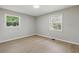 This bedroom has a pair of windows, neutral paint and light wood flooring for a bright, airy feel at 1383 Palmer Sw Pl, Mableton, GA 30126