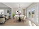 Bright dining area featuring a modern light fixture and access to a deck at 1383 Palmer Sw Pl, Mableton, GA 30126