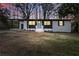 Charming renovated home featuring a blue front door and modern black and white accents at 1383 Palmer Sw Pl, Mableton, GA 30126