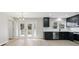 Modern kitchen with dark cabinets, stainless steel appliances, and stylish lighting at 1383 Palmer Sw Pl, Mableton, GA 30126