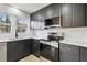 Well-equipped kitchen featuring modern appliances and sleek countertops at 1383 Palmer Sw Pl, Mableton, GA 30126