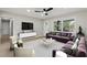 Inviting living room featuring hardwood floors, a fireplace, and lots of natural light at 1383 Palmer Sw Pl, Mableton, GA 30126