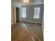 Bedroom with natural light, spacious closet and modern floors at 361 Oak Harbor Trl, Marietta, GA 30066