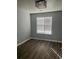 Bedroom featuring a modern lighting fixture and bright window at 361 Oak Harbor Trl, Marietta, GA 30066