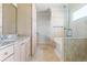 Bathroom featuring bathtub with glass shower and vanity at 640 Irwin Ne St, Atlanta, GA 30312