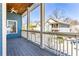 View of a charming porch with ceiling fan overlooking the nearby houses and treeline at 640 Irwin Ne St, Atlanta, GA 30312