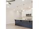 Kitchen island with white countertops and dark colored cabinetry at 4659 Larkfield Way, Powder Springs, GA 30127