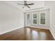 Bedroom features wood floors, tray ceiling and lots of light through the multiple windows at 537 Pearl St, Cumming, GA 30040