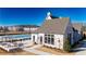 Charming clubhouse featuring white brick, an outdoor lounge area, and a pool at 537 Pearl St, Cumming, GA 30040