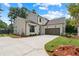 Two-story home featuring a two-car garage, spacious driveway, and manicured lawn with landscape at 537 Pearl St, Cumming, GA 30040