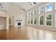 Bright living room with hardwood floors, fireplace and large windows providing an abundance of natural light at 537 Pearl St, Cumming, GA 30040