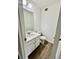 Half bathroom with single sink vanity, modern faucet, and toilet at 5463 Forest East Ln, Stone Mountain, GA 30088