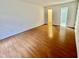 Bright bedroom with hardwood floors, closet, and ensuite bathroom at 5463 Forest East Ln, Stone Mountain, GA 30088