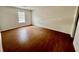 Bedroom with wood floors and bright natural light from the window at 5463 Forest East Ln, Stone Mountain, GA 30088