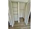 View of closet with white louvered doors and shelving at 5463 Forest East Ln, Stone Mountain, GA 30088