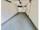A spacious two-car garage is complete with painted floor and plenty of storage space at 5463 Forest East Ln, Stone Mountain, GA 30088