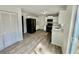 Modern kitchen featuring stainless appliances, sleek countertops, and modern wood-look floor at 5463 Forest East Ln, Stone Mountain, GA 30088