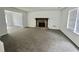 Inviting living room featuring a stone fireplace and neutral color palette at 5463 Forest East Ln, Stone Mountain, GA 30088